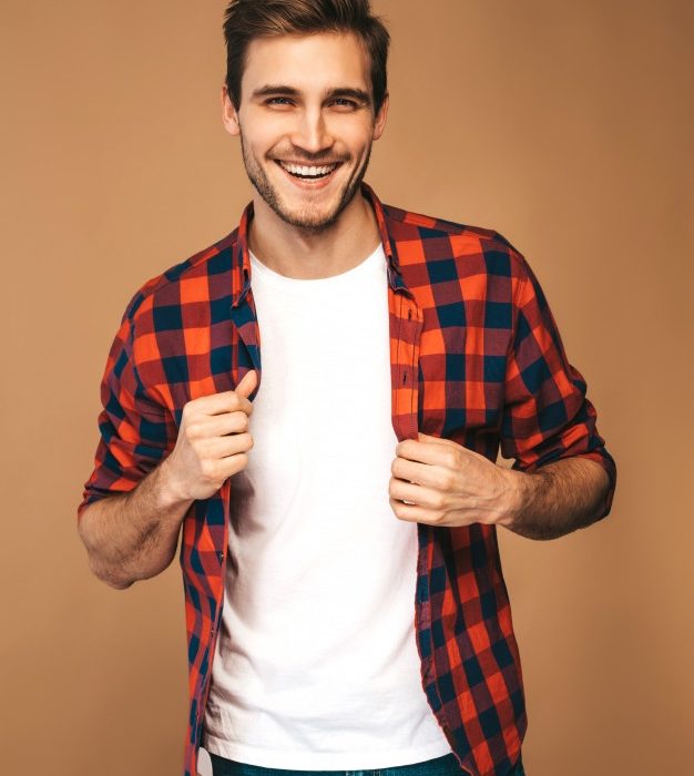 portrait-handsome-smiling-stylish-young-man-model-dressed-red-checkered-shirt-fashion-man-posing_158538-4914